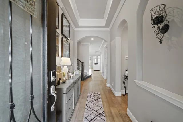 a view of an entryway with wooden floor and stairs