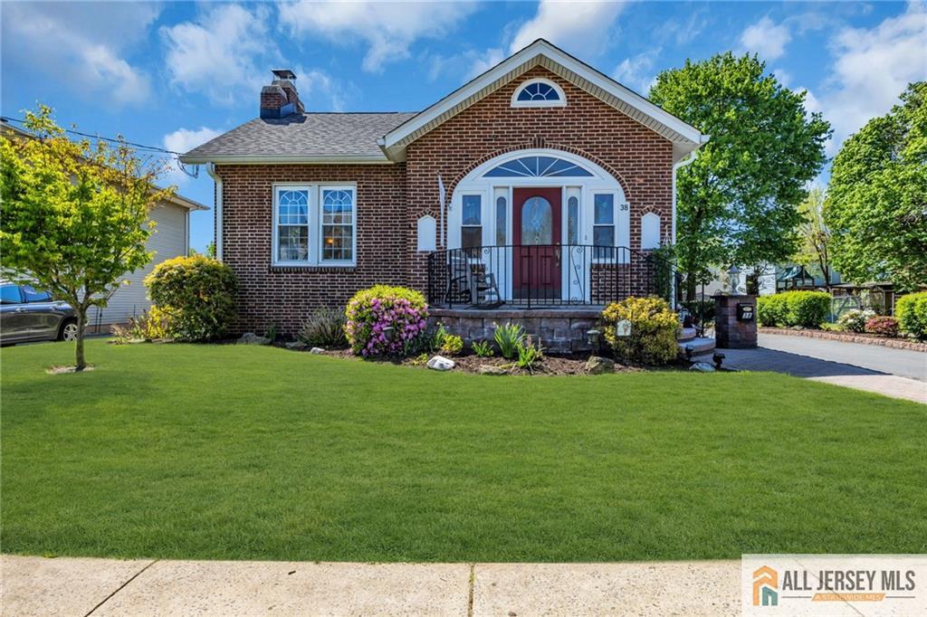 38 Simpson Avenue Edison, NJ 08817 - Photo 1 of 37 a front view of a house with garden