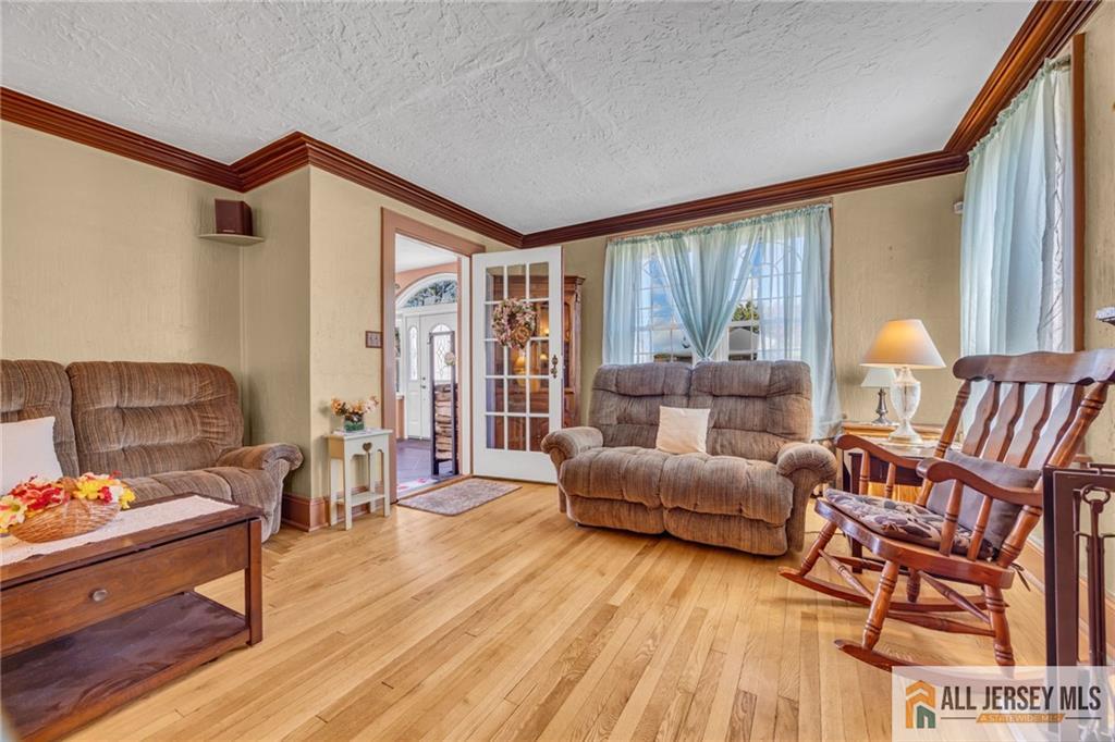 38 Simpson Avenue Edison, NJ 08817 - Photo 11 of 37 a living room with furniture and a wooden floor