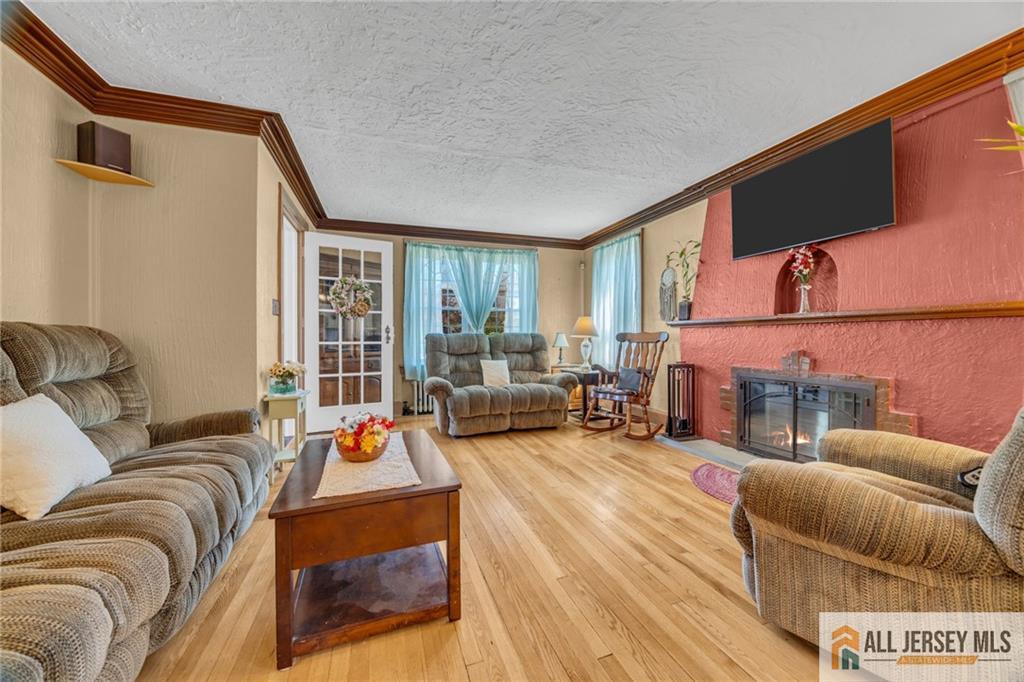 38 Simpson Avenue Edison, NJ 08817 - Photo 12 of 37 a living room with furniture and a large window
