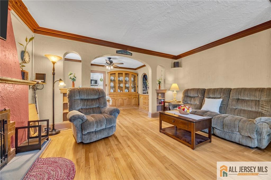 38 Simpson Avenue Edison, NJ 08817 - Photo 15 of 37 a living room with furniture and a large window
