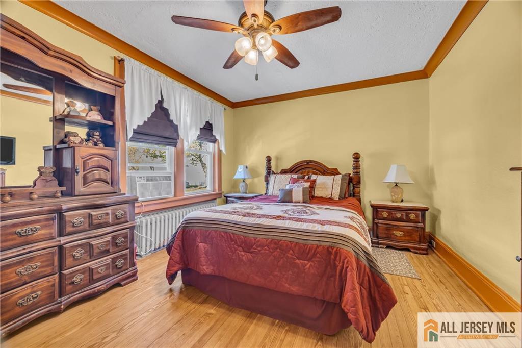 38 Simpson Avenue Edison, NJ 08817 - Photo 19 of 37 a bedroom with a bed and a chandelier