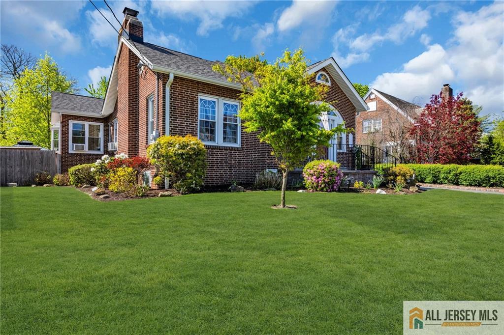 38 Simpson Avenue Edison, NJ 08817 - Photo 2 of 37 a front view of a house with a garden