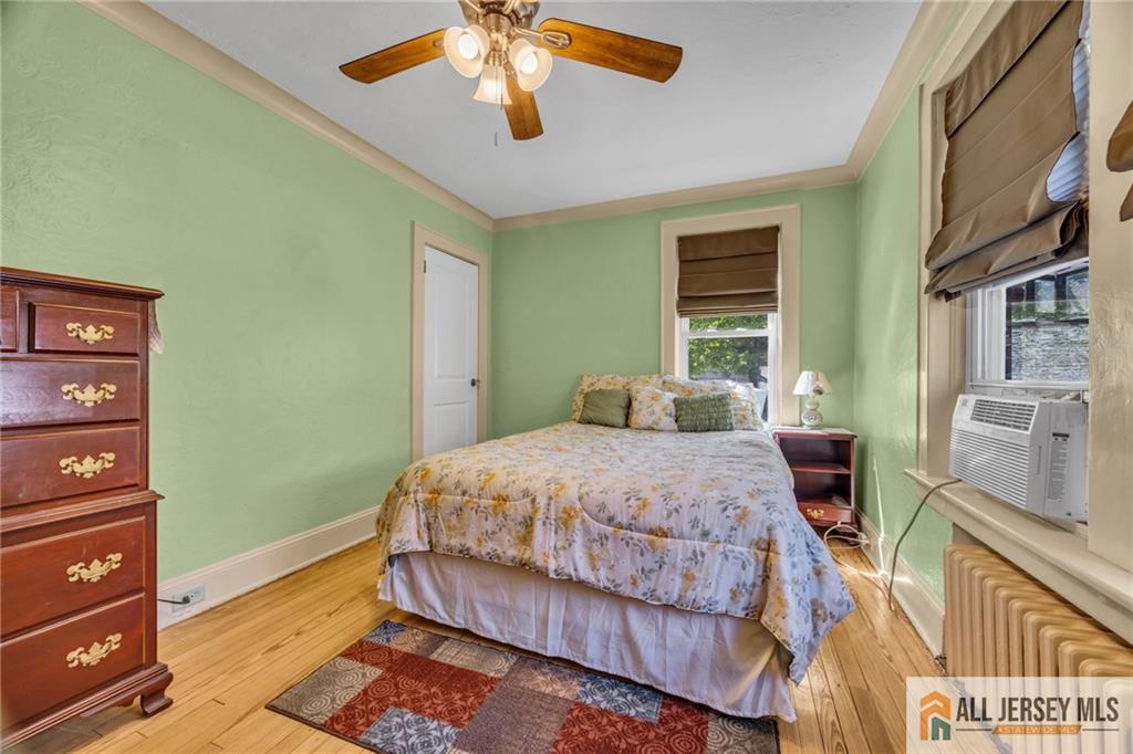 38 Simpson Avenue Edison, NJ 08817 - Photo 21 of 37 a bedroom with a bed and a chandelier