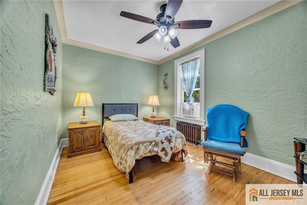 38 Simpson Avenue Edison, NJ 08817 - Photo 22 of 37 a bedroom with a bed and window