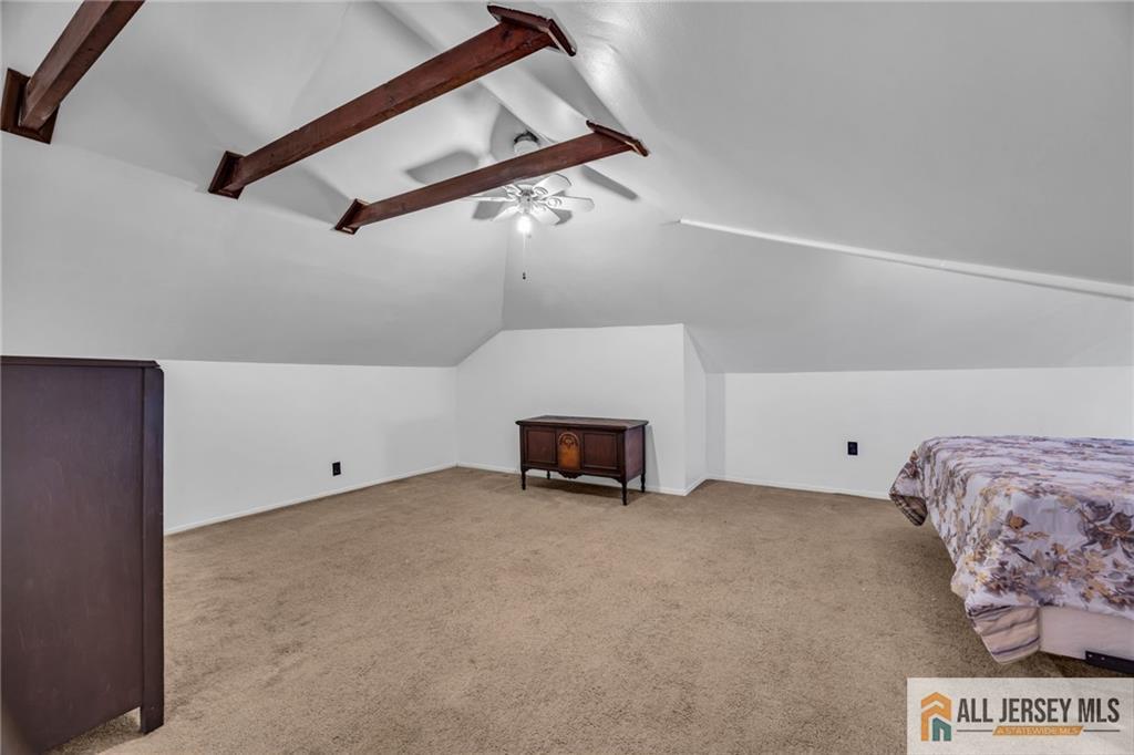 38 Simpson Avenue Edison, NJ 08817 - Photo 26 of 37 a view of room with stairs and a chandelier
