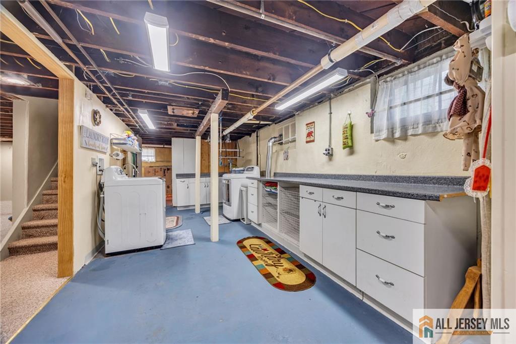 38 Simpson Avenue Edison, NJ 08817 - Photo 29 of 37 a utility room with dryer and washer