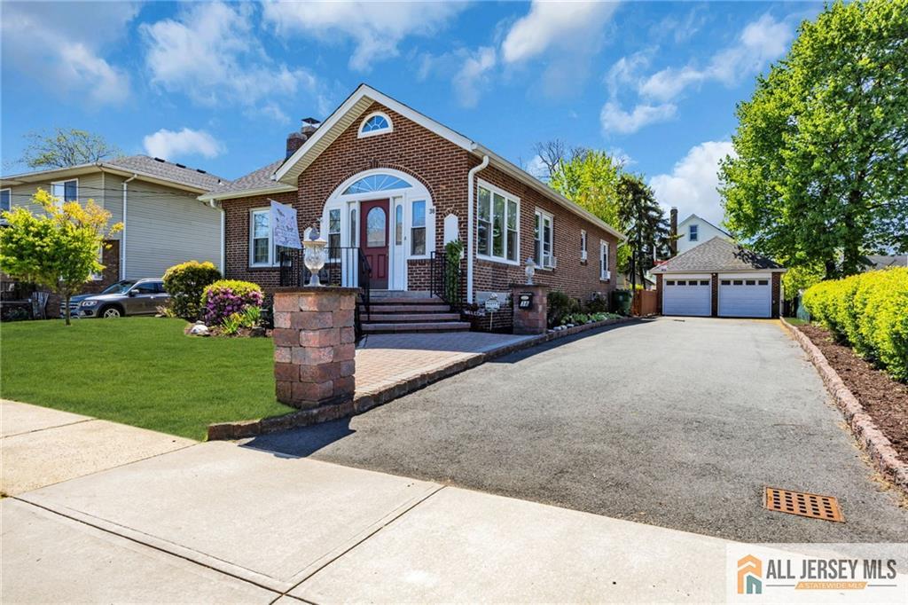 38 Simpson Avenue Edison, NJ 08817 - Photo 3 of 37 a front view of a house with garden