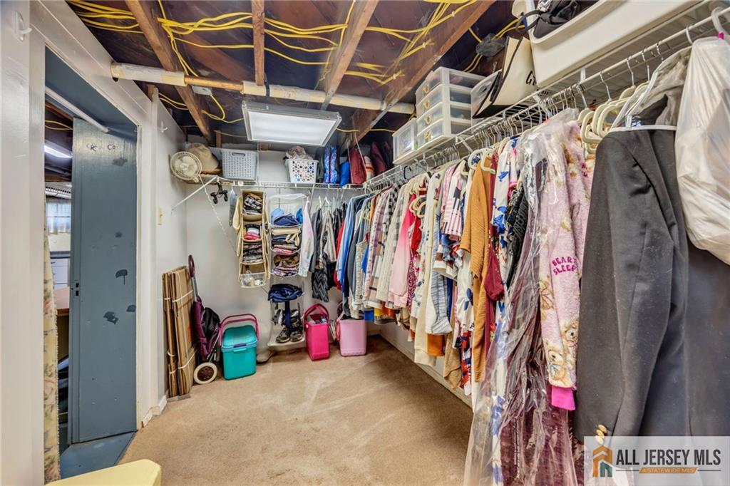 38 Simpson Avenue Edison, NJ 08817 - Photo 31 of 37 a view of walk in closet with clothes