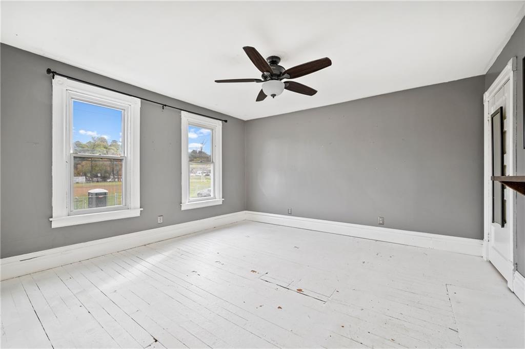 840 7th Street Verona, PA 15147 - Photo 16 of 32 an empty room with windows and fan