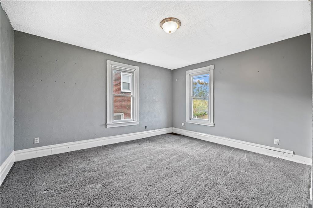 840 7th Street Verona, PA 15147 - Photo 19 of 32 a view of an empty room with a window