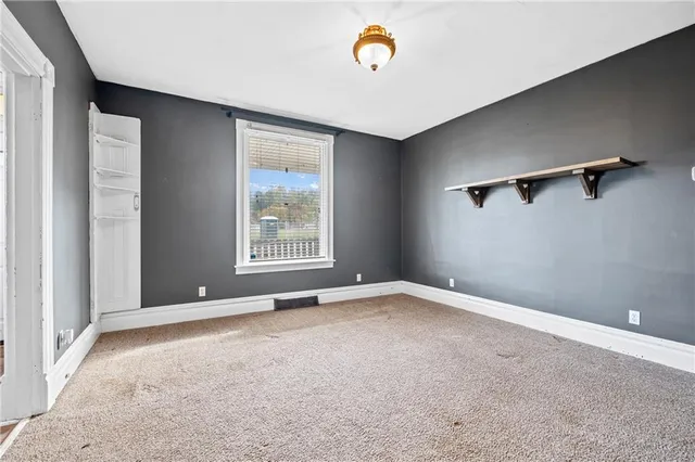 an empty room with windows