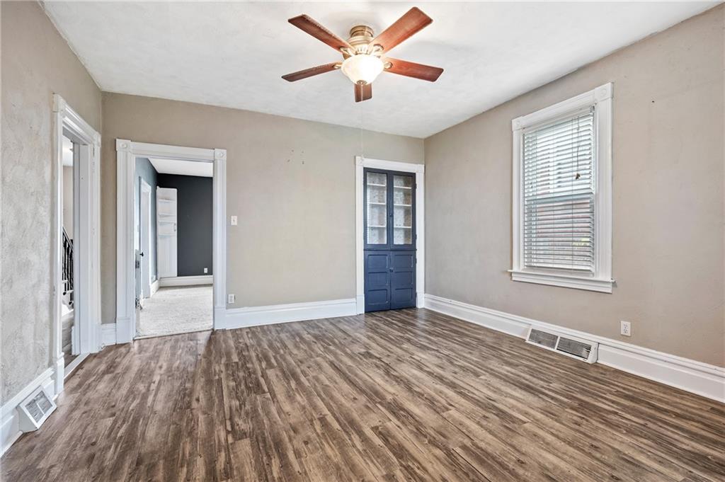 840 7th Street Verona, PA 15147 - Photo 9 of 32 a view of an empty room with wooden floor and a window