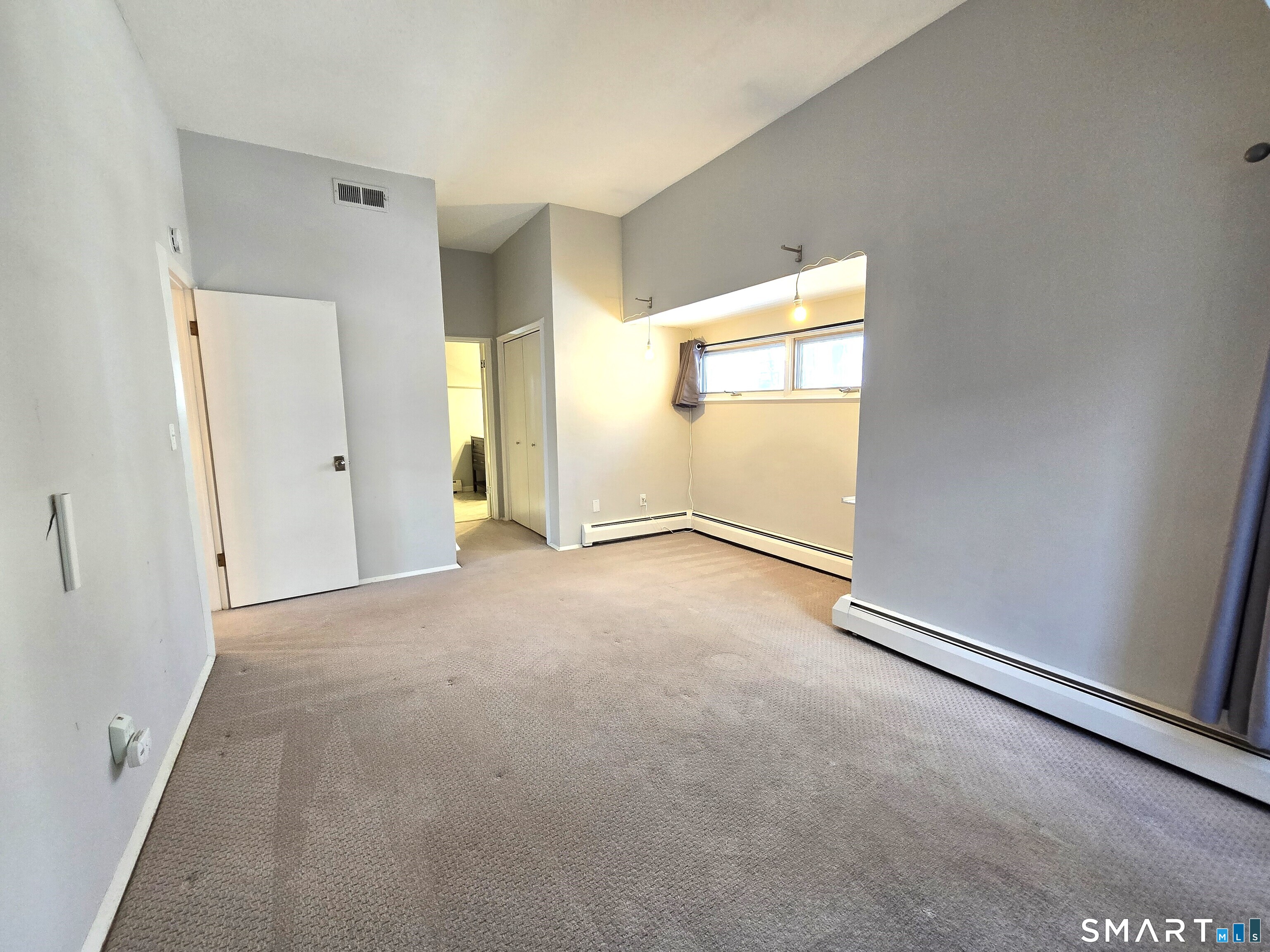 7 Staunton Court, Unit E Farmington, CT 06032 - Photo 15 of 29 an empty room with windows