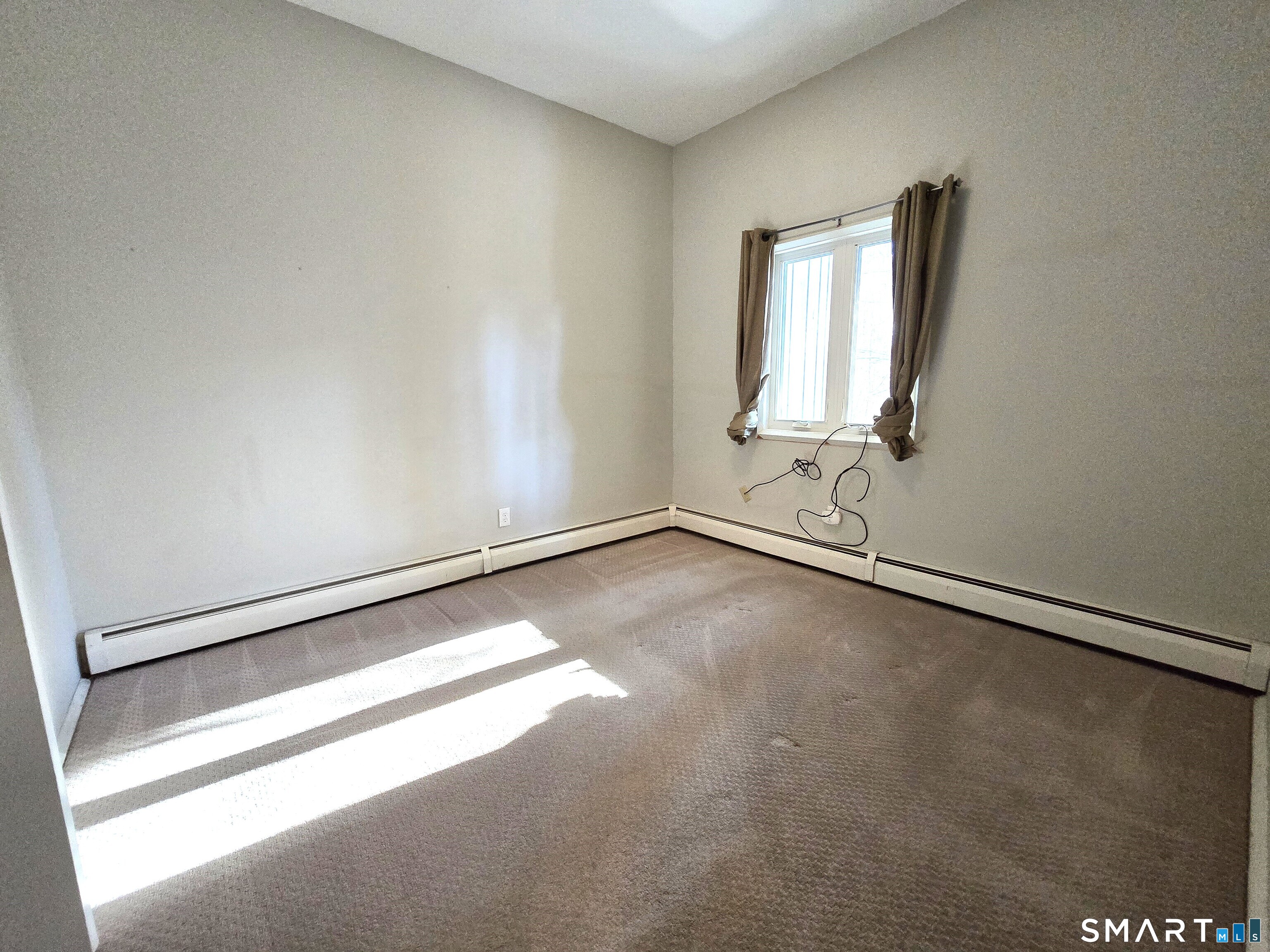 7 Staunton Court, Unit E Farmington, CT 06032 - Photo 19 of 29 an empty room with a window
