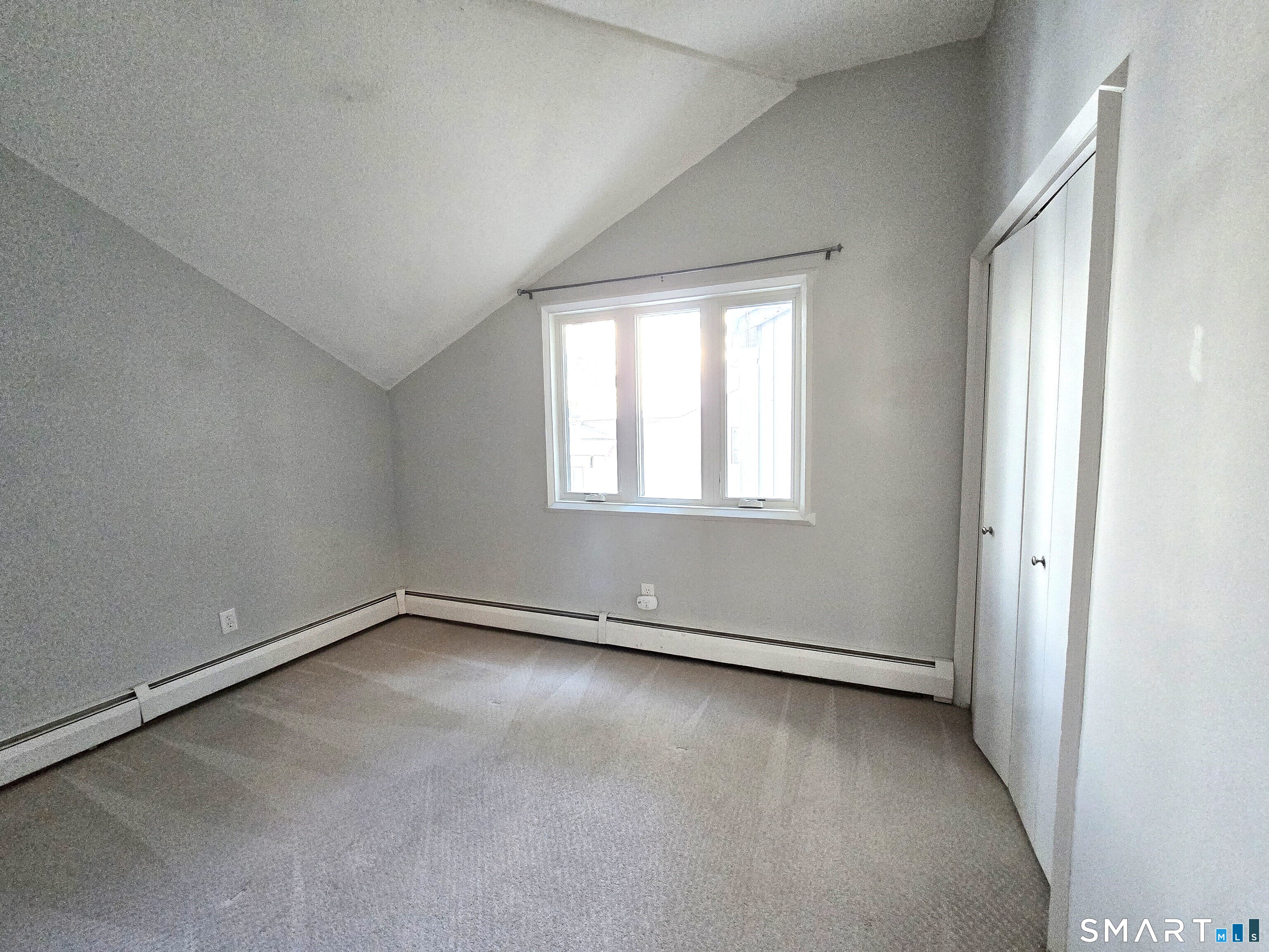 7 Staunton Court, Unit E Farmington, CT 06032 - Photo 22 of 29 an empty room with a window