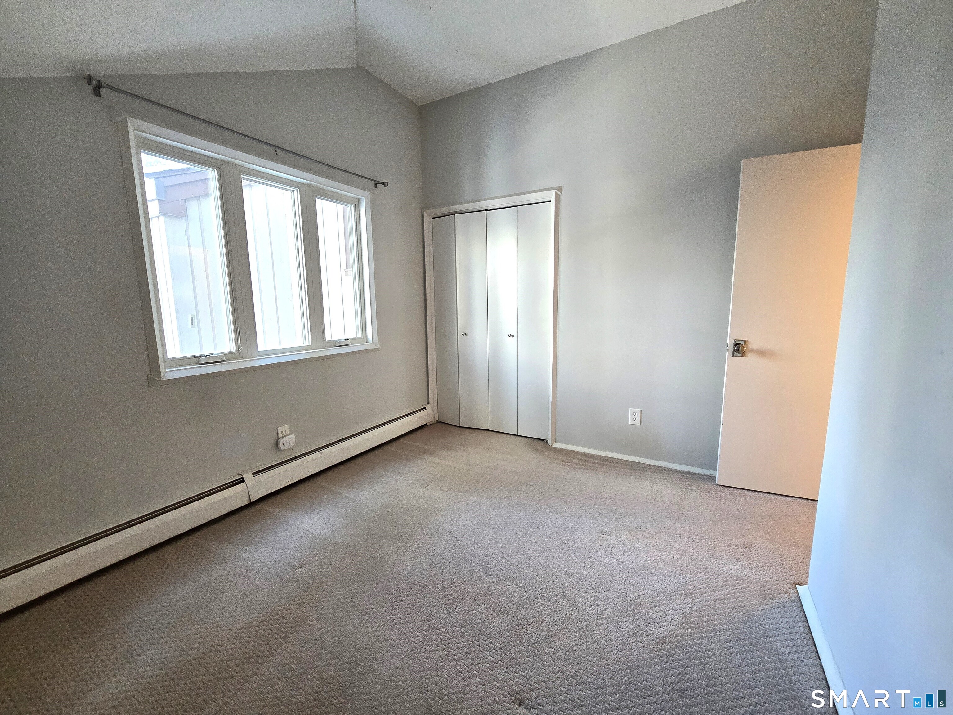 7 Staunton Court, Unit E Farmington, CT 06032 - Photo 23 of 29 an empty room with windows