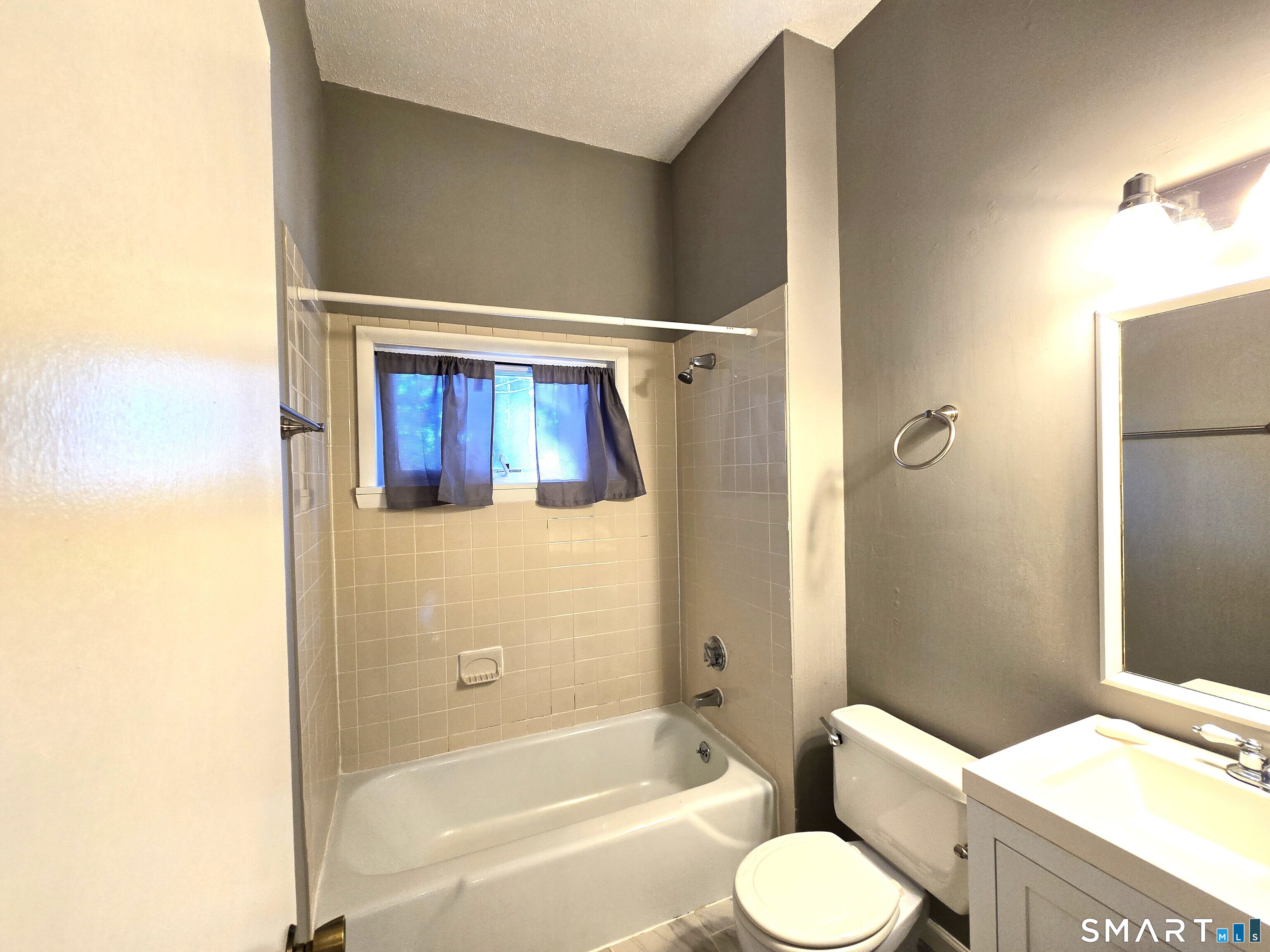 7 Staunton Court, Unit E Farmington, CT 06032 - Photo 25 of 29 a bathroom with a sink toilet and shower