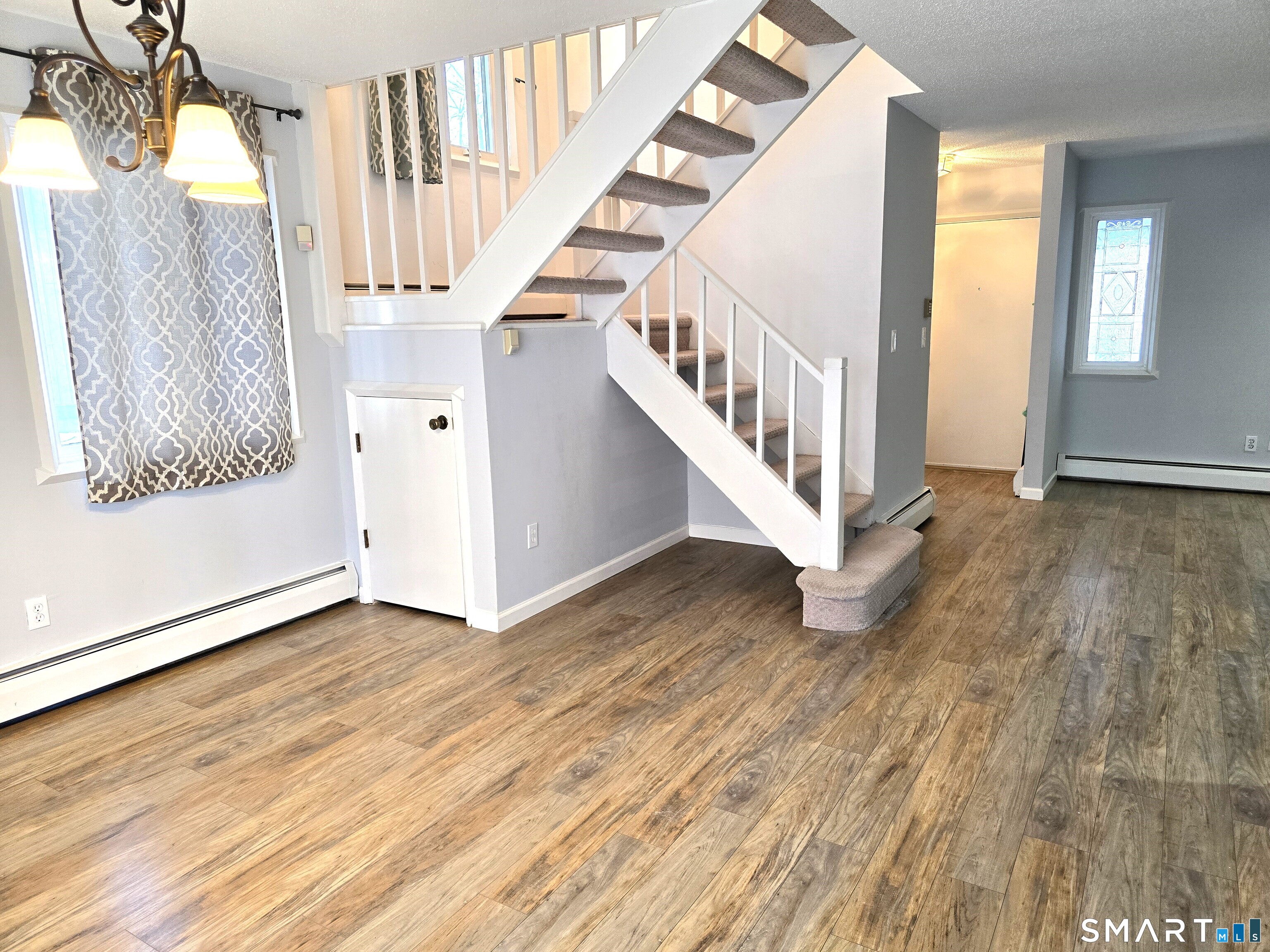 7 Staunton Court, Unit E Farmington, CT 06032 - Photo 8 of 29 a view of an entryway with wooden floor