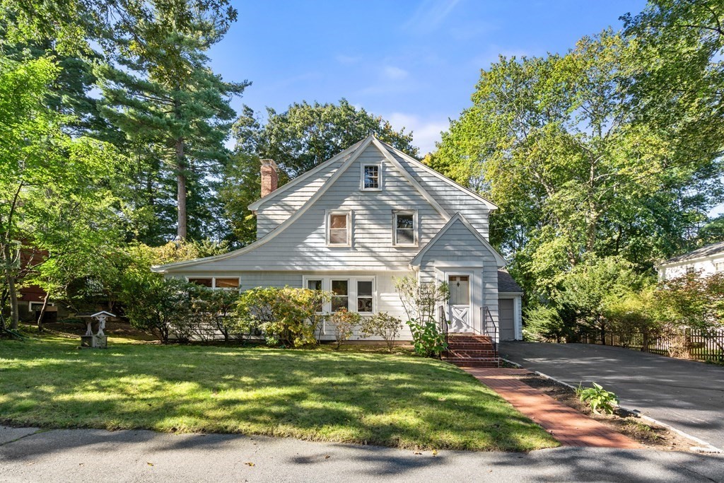 49 Pierrepont Road Newton, MA 02462 - Photo 1 of 16 a front view of a house with a garden