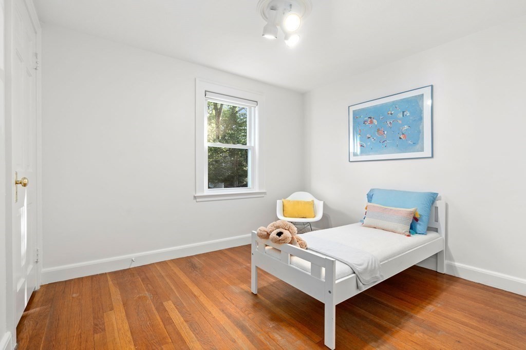 49 Pierrepont Road Newton, MA 02462 - Photo 11 of 16 a living room with furniture and a window