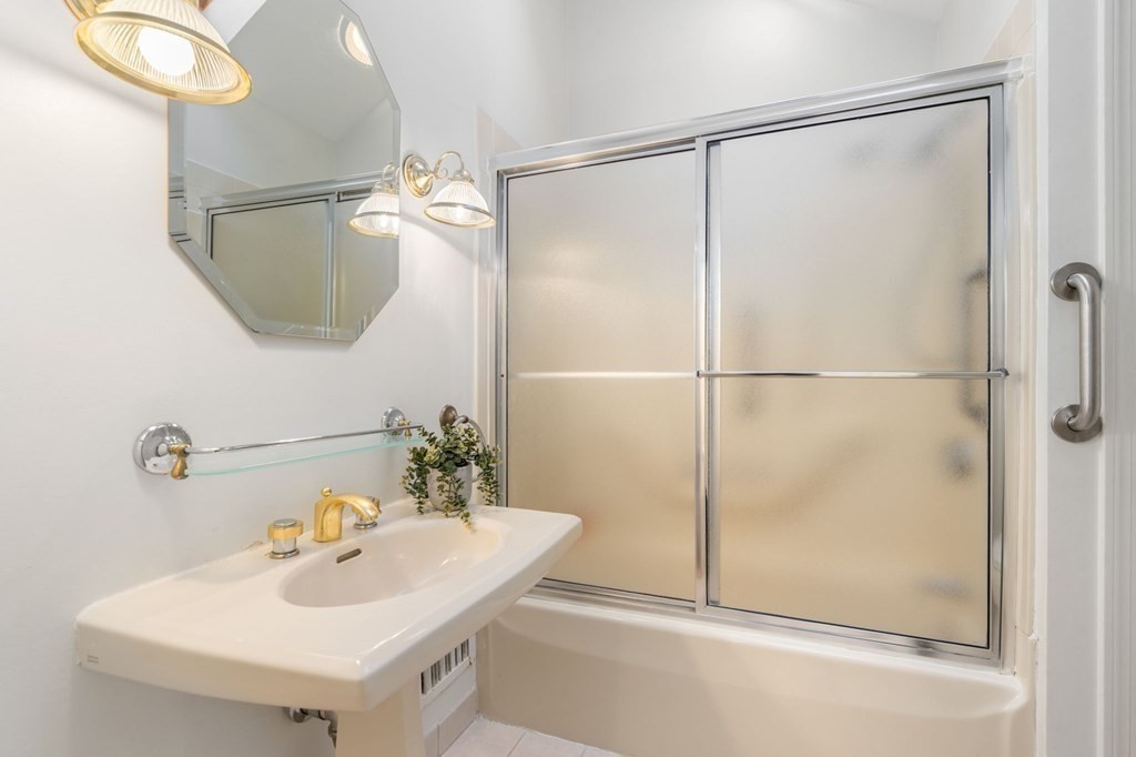 49 Pierrepont Road Newton, MA 02462 - Photo 12 of 16 a bathroom with a sink and a mirror