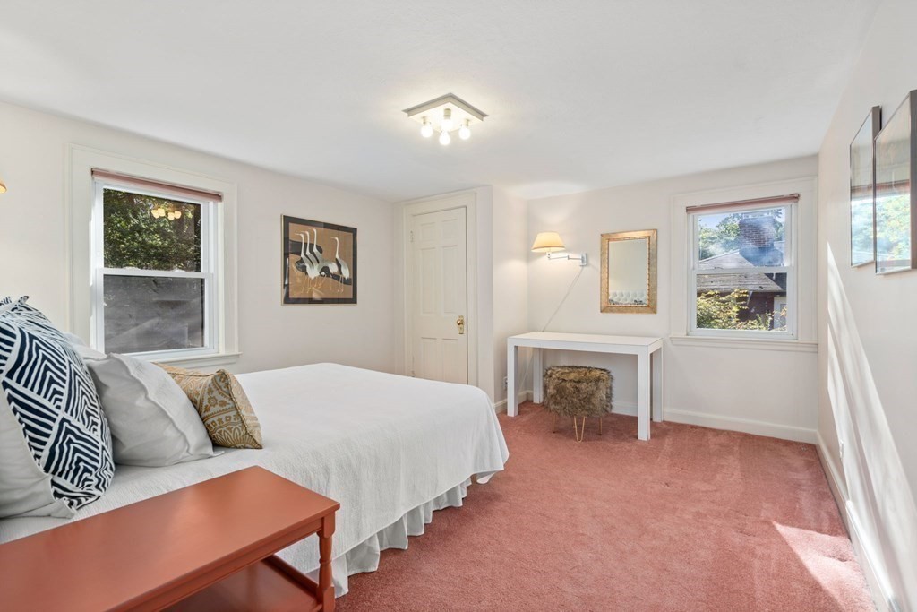 49 Pierrepont Road Newton, MA 02462 - Photo 13 of 16 a bedroom with a bed and a couch