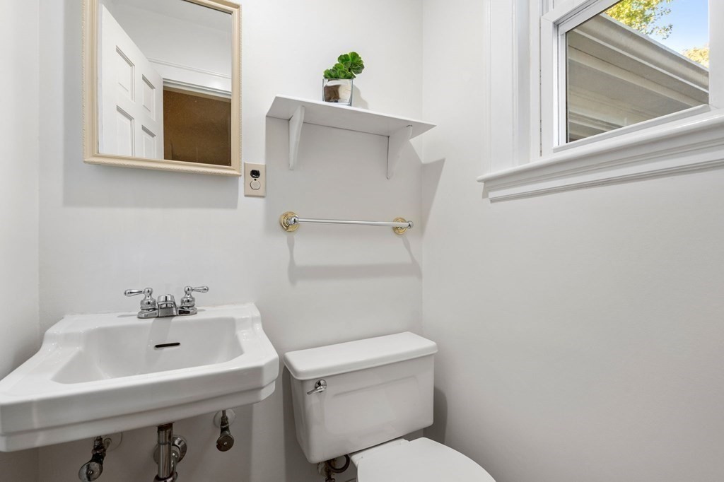 49 Pierrepont Road Newton, MA 02462 - Photo 7 of 16 a bathroom with a sink a toilet and mirror