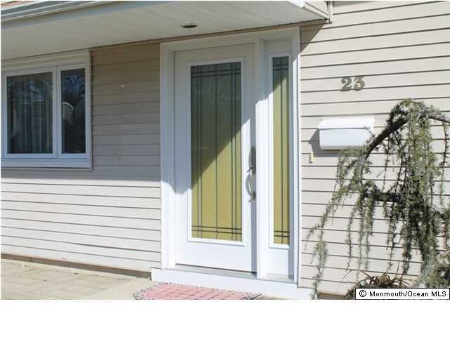 23 Pittsfield Road Howell, NJ 07731 - Photo 2 of 24 a view of a door of a house with a door and a window