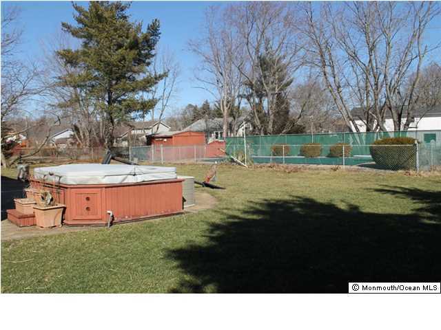 23 Pittsfield Road Howell, NJ 07731 - Photo 22 of 24 a backyard of a house with lots of green space