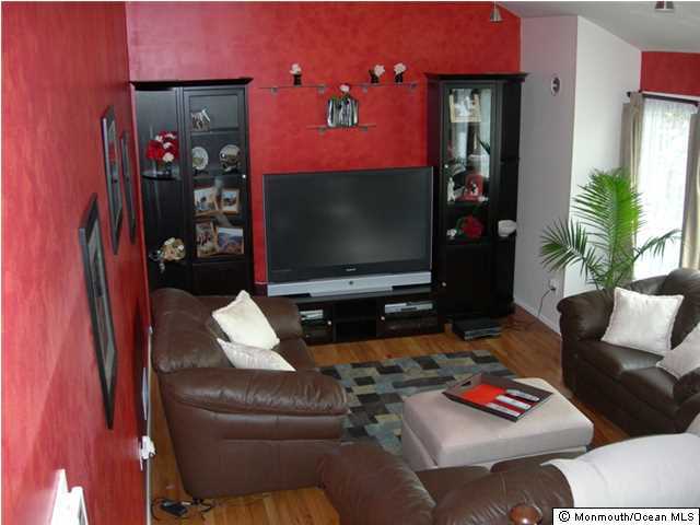 23 Pittsfield Road Howell, NJ 07731 - Photo 4 of 24 a living room with furniture and a flat screen tv