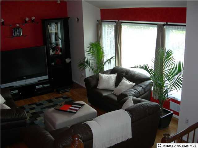 23 Pittsfield Road Howell, NJ 07731 - Photo 5 of 24 a living room with furniture and a flat screen tv