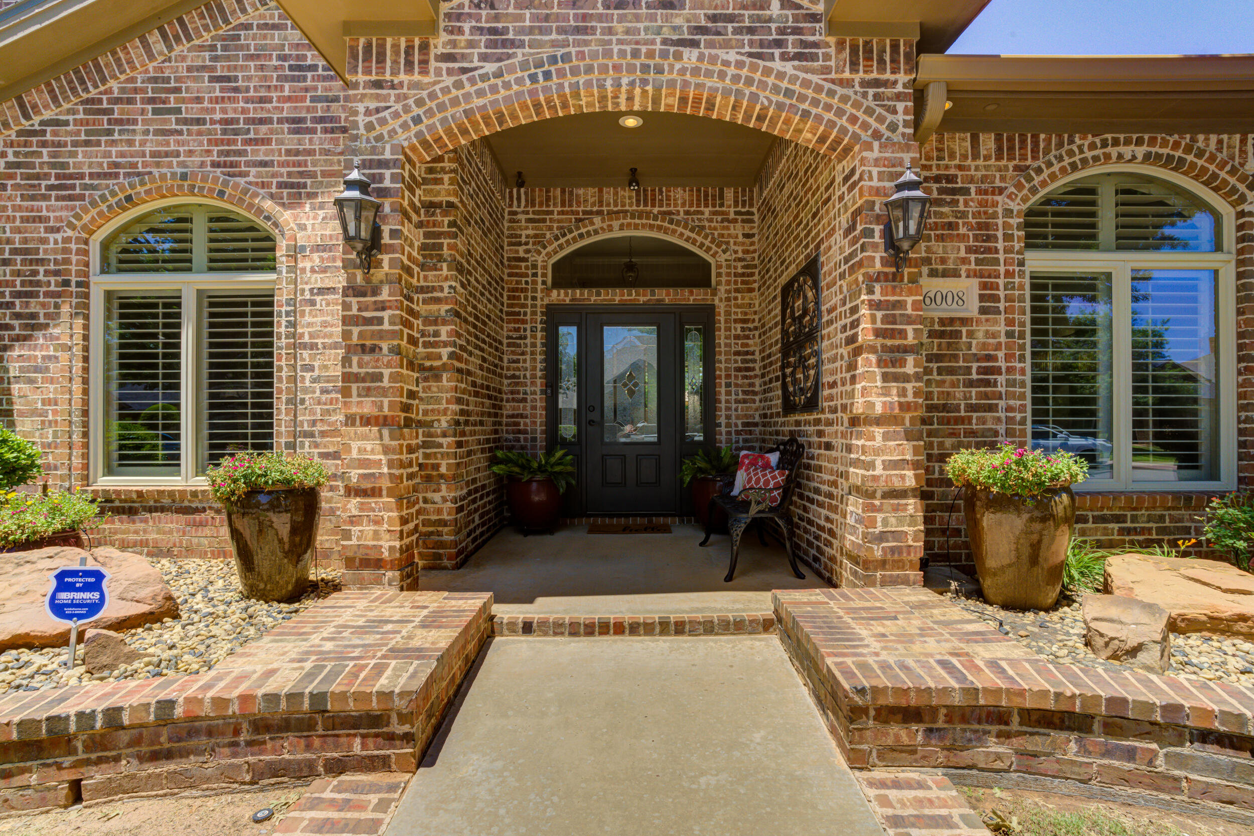 6008 89th Street Lubbock, TX 79424 - Photo 3 of 61 a front view of a house with outdoor seating