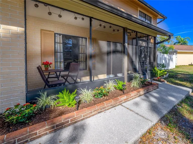 a view of a room with wooden floor and white walls