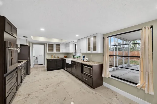 a view of a dining room with furniture and window