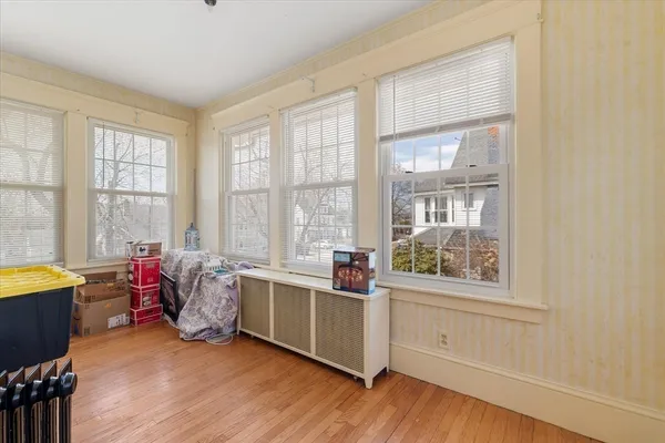 a living room with furniture and windows