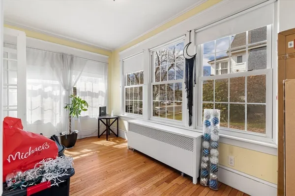 a living room with furniture window and wooden floor