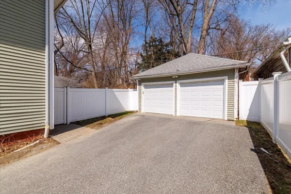 a view of backyard and garage