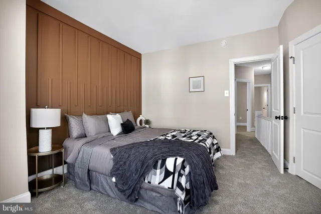 a bedroom with a bed and a cabinets