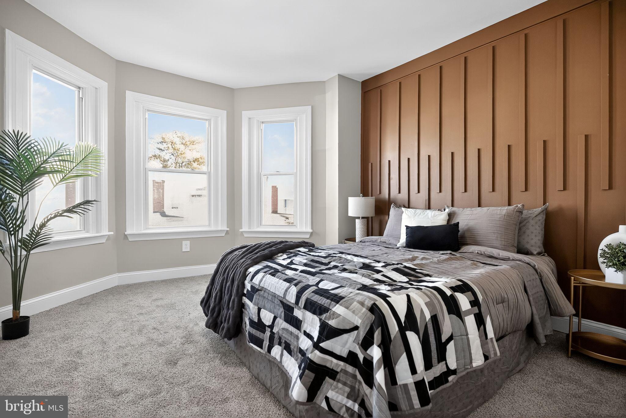 258 West Sheldon Street Philadelphia, PA 19120 - Photo 18 of 29 a bedroom with a large bed and a window