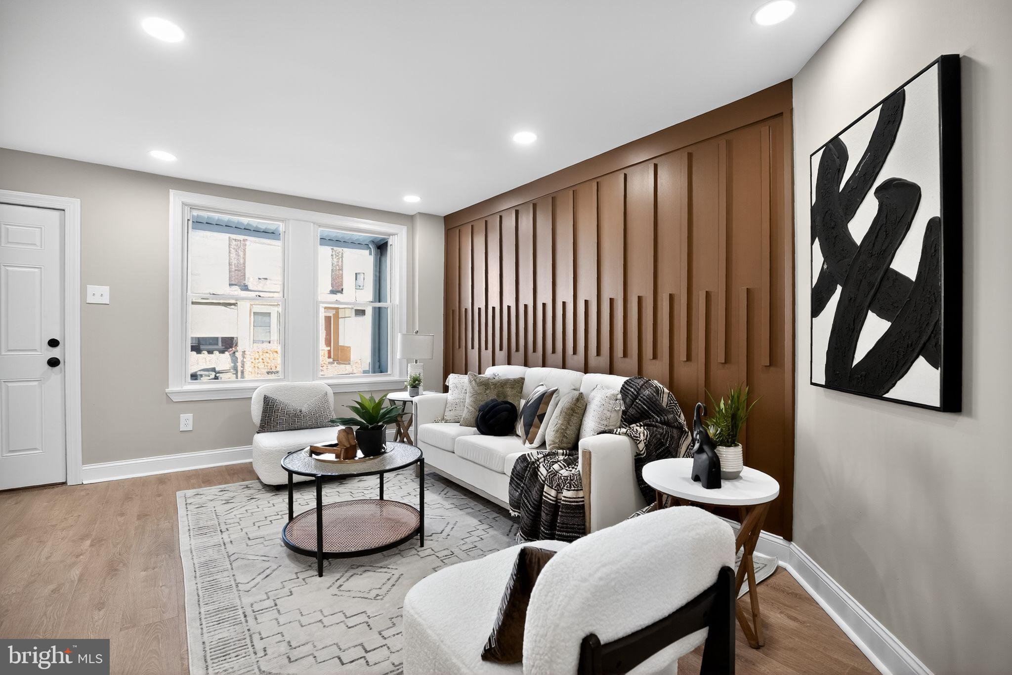 258 West Sheldon Street Philadelphia, PA 19120 - Photo 2 of 29 a living room with furniture and a window