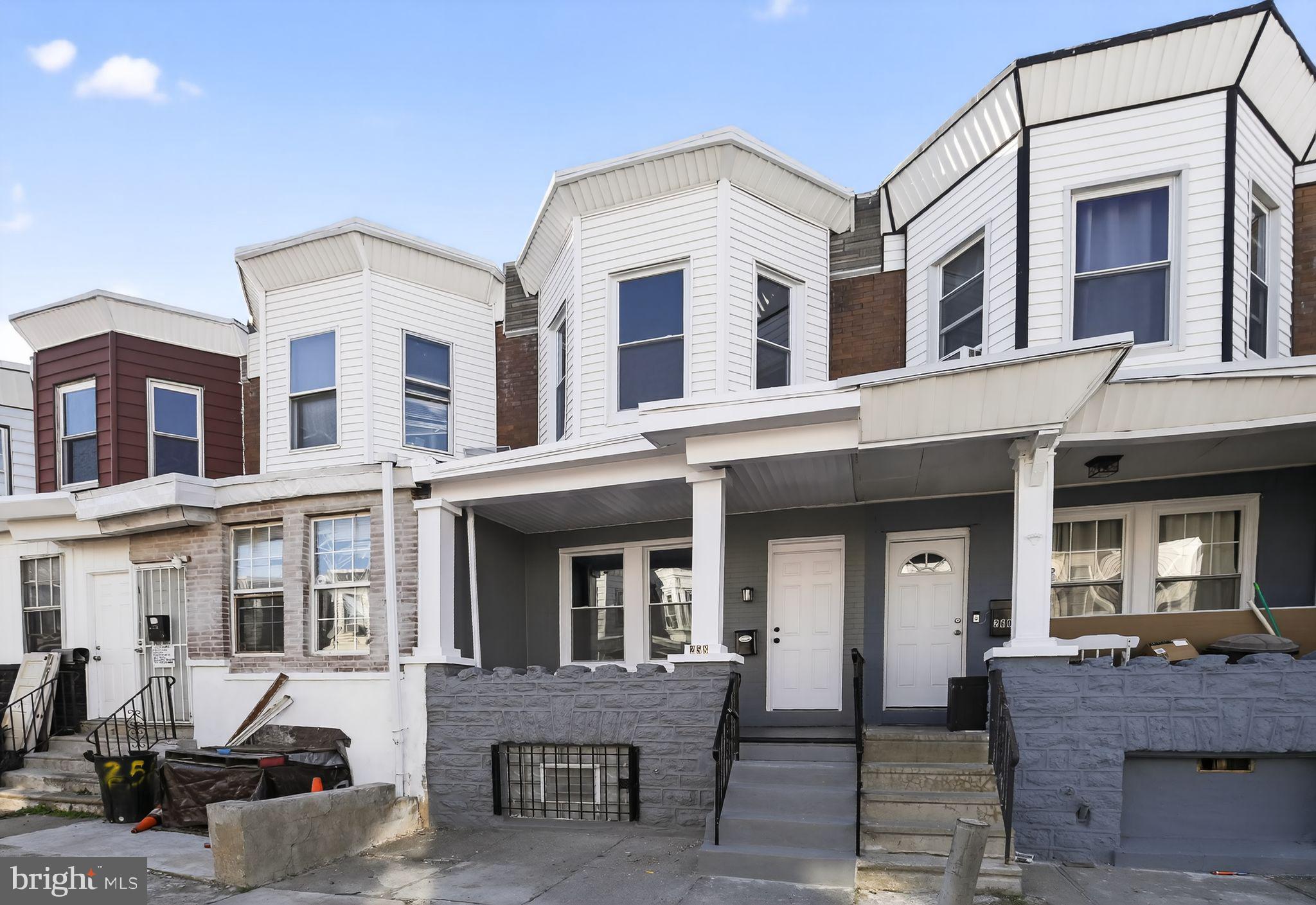 258 West Sheldon Street Philadelphia, PA 19120 - Photo 26 of 29 a front view of a residential apartment building with a yard
