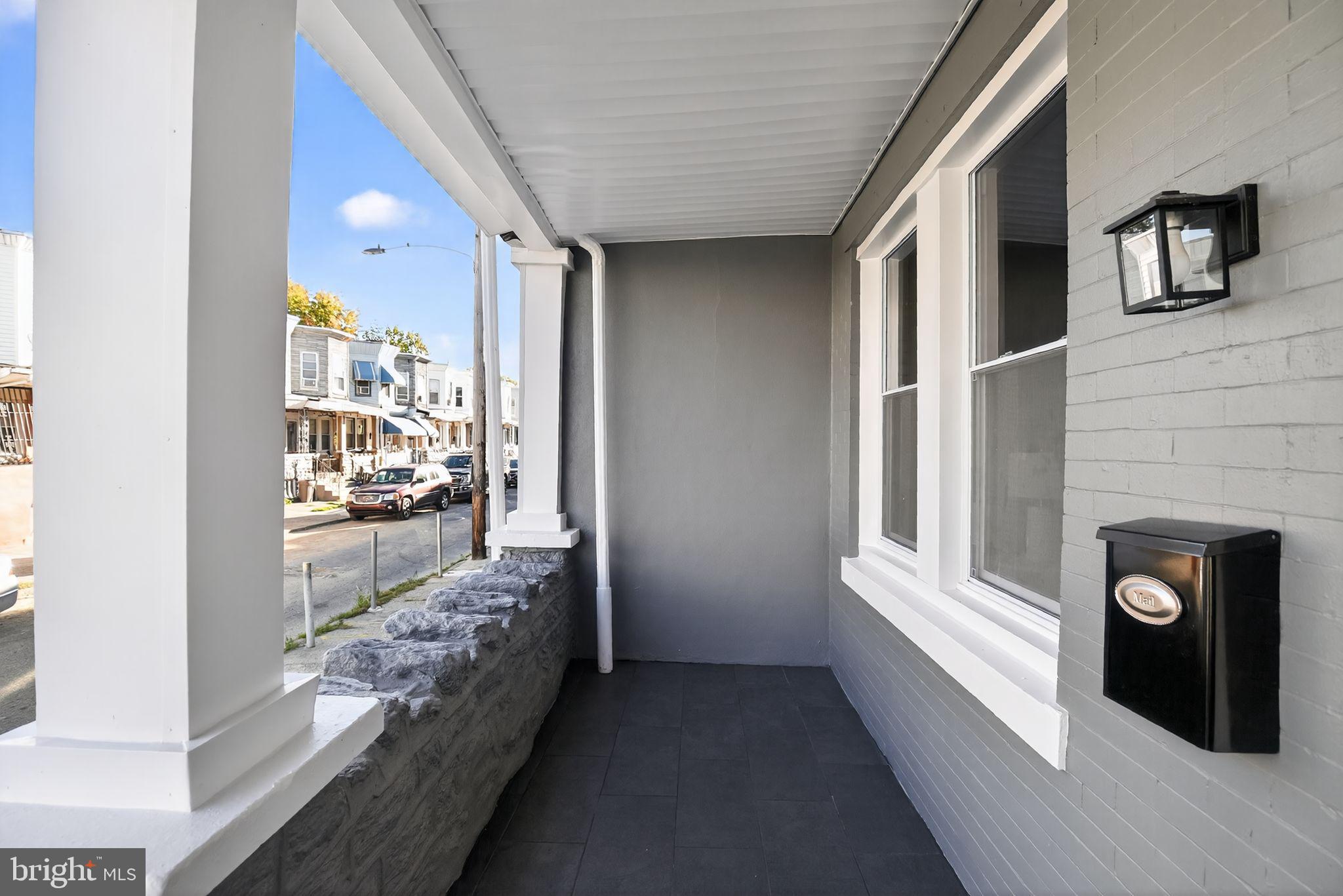 258 West Sheldon Street Philadelphia, PA 19120 - Photo 27 of 29 a view of a hallway and a livingroom with furniture