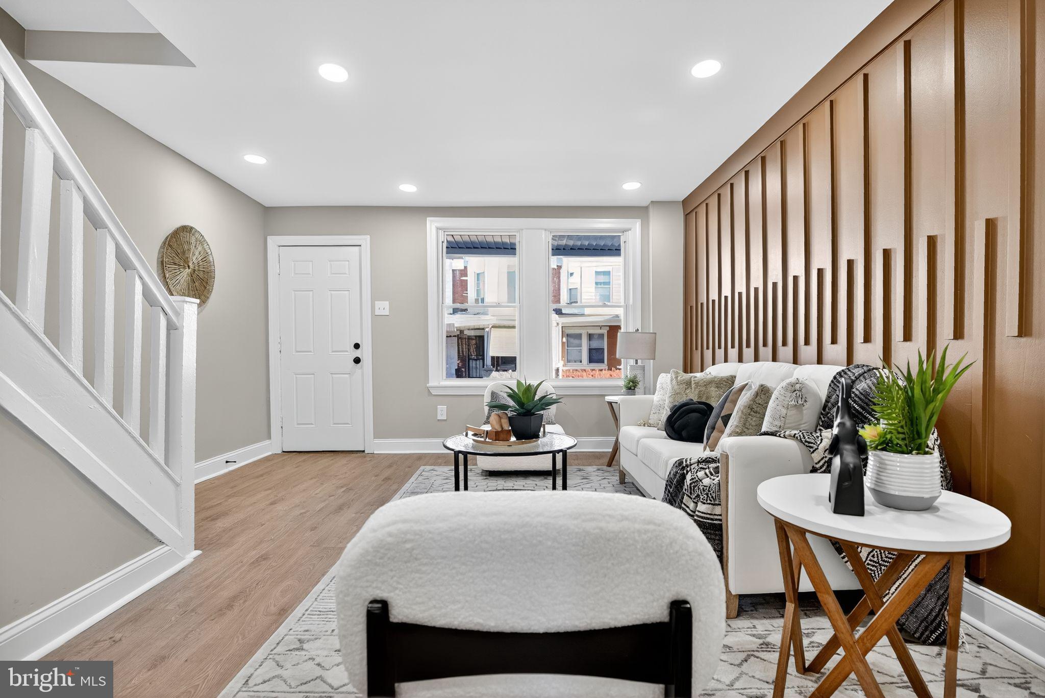 258 West Sheldon Street Philadelphia, PA 19120 - Photo 3 of 29 a living room with furniture and a potted plant