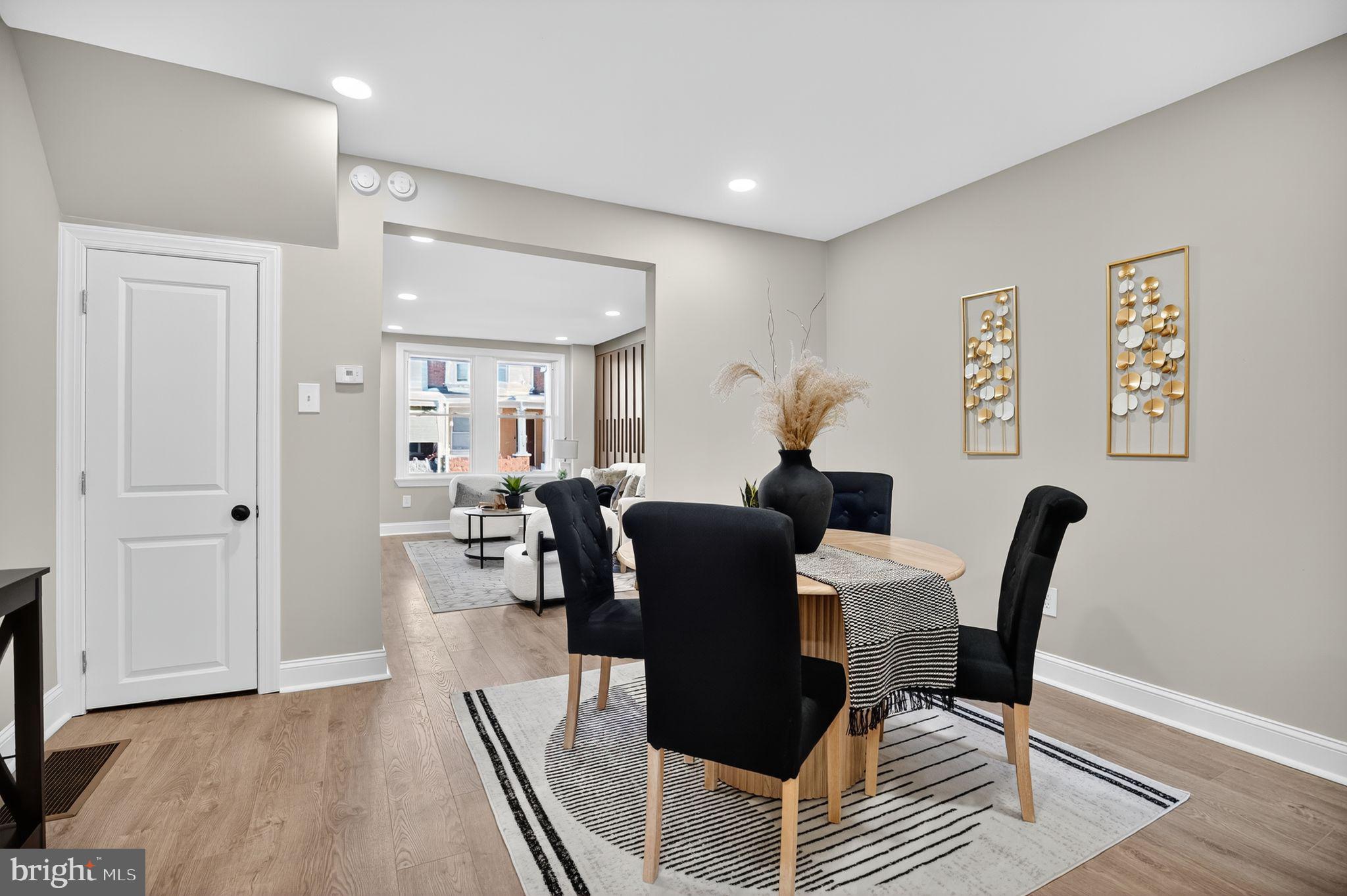 258 West Sheldon Street Philadelphia, PA 19120 - Photo 7 of 29 a living room with furniture a wooden floor and a potted plant