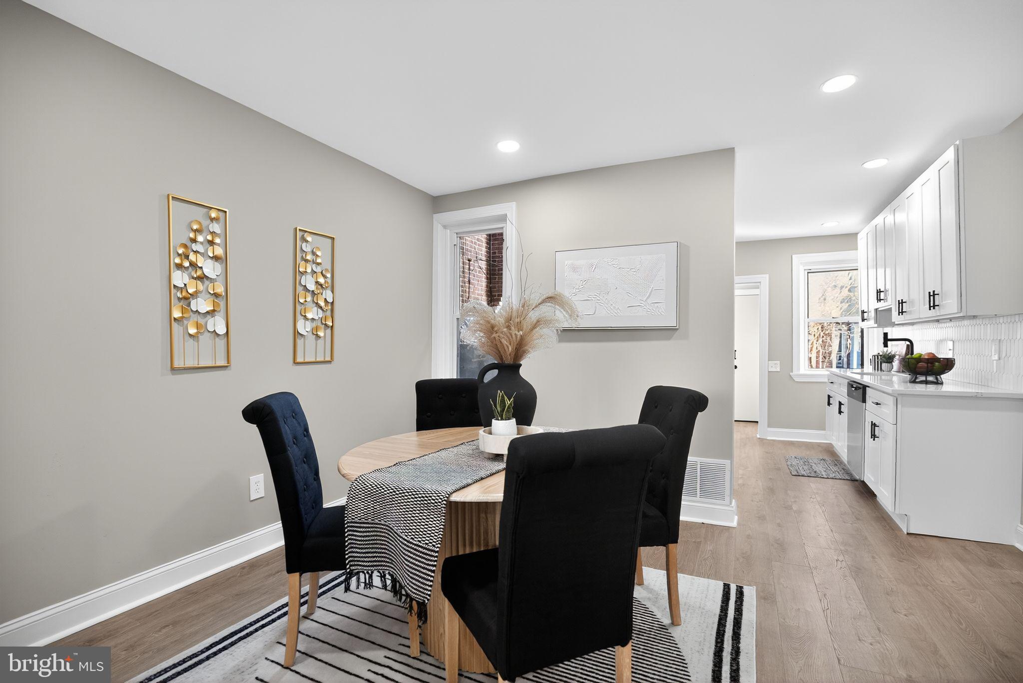 258 West Sheldon Street Philadelphia, PA 19120 - Photo 8 of 29 a view of a dining room with furniture and wooden floor