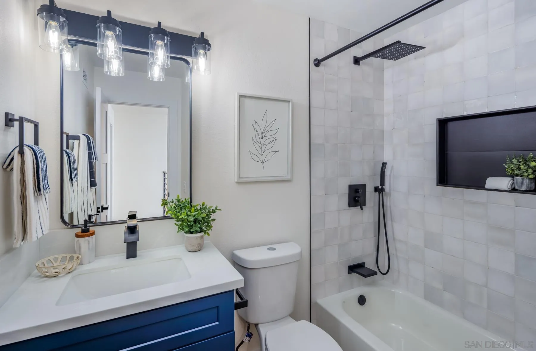 1986 Azure Way Encinitas, CA 92024 - Photo 19 of 20 a bathroom with a sink toilet a mirror and shower