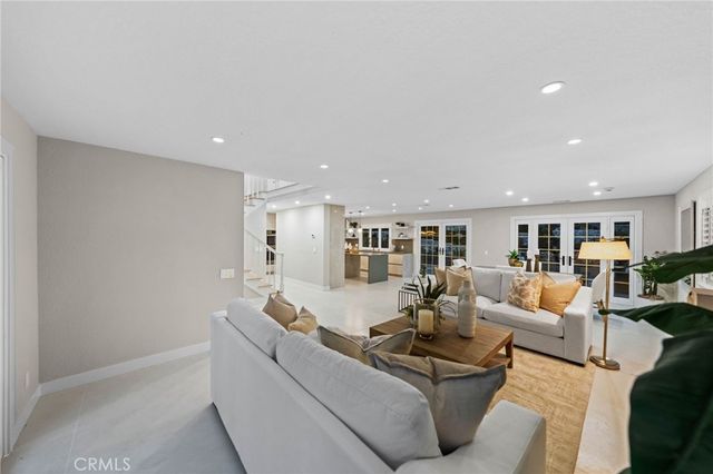 a large kitchen with stainless steel appliances lots of counter top space