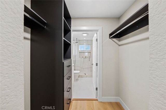 a living room with furniture large window and a flat screen tv