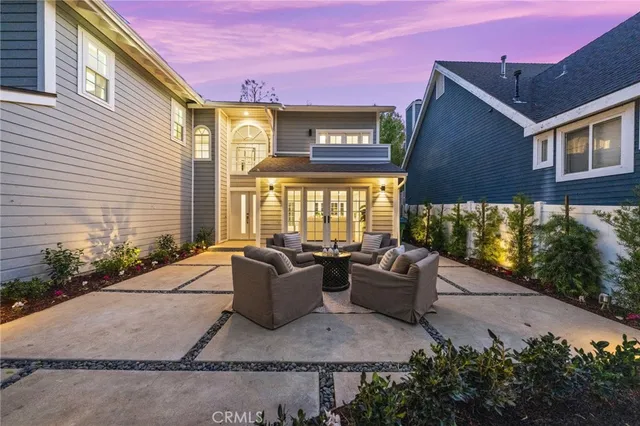 a front view of a house with lots of green space